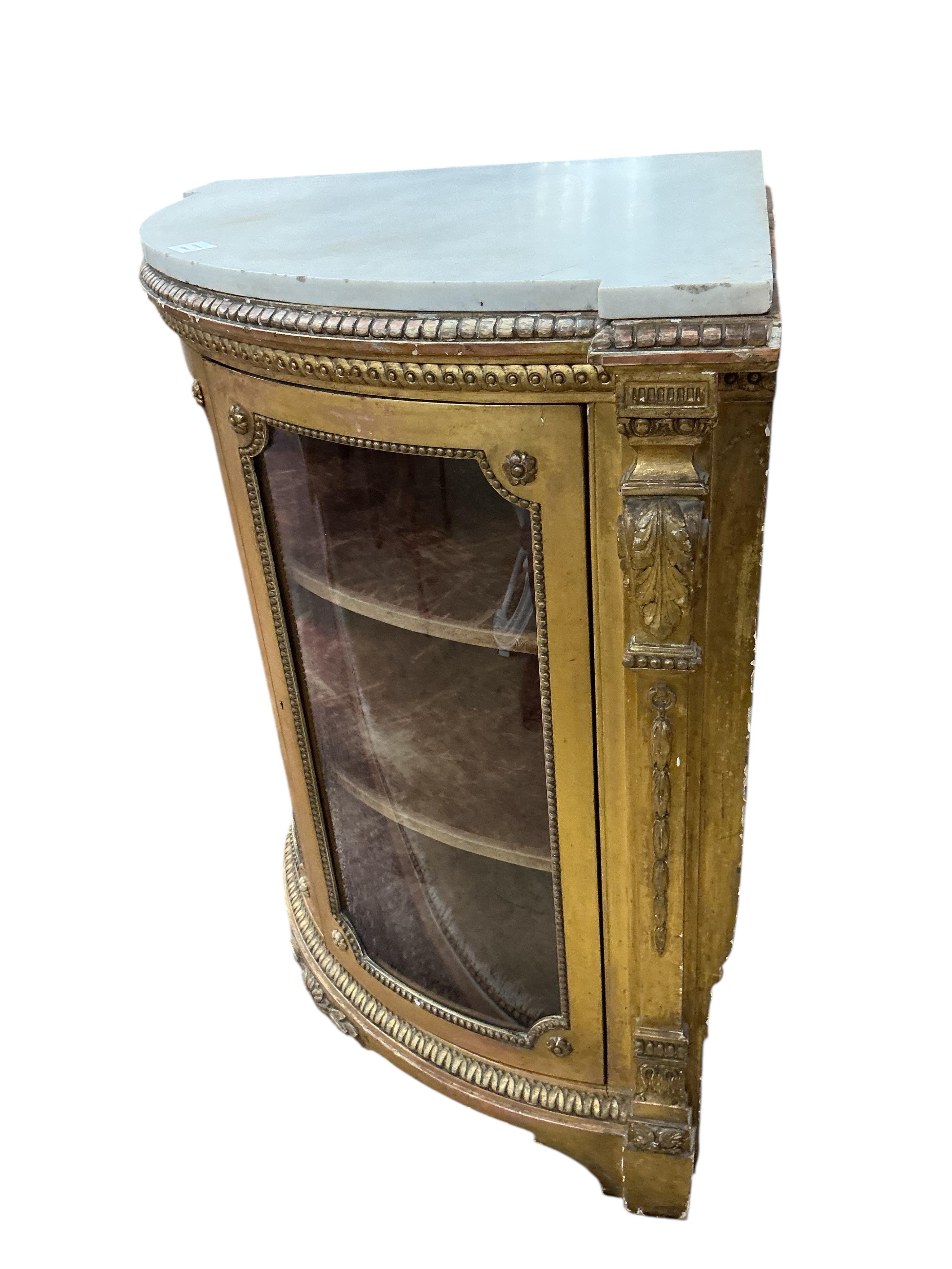 A Louis XVI style giltwood and composition marble topped corner cabinet, width 94cm, depth 69cm, height 95cm